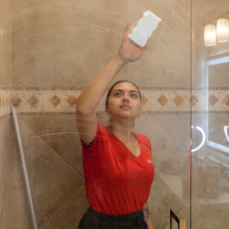 A woman is cleaning the bathroom in Phoenix, AZ