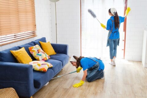 Two cleaners cleaning a home in Phoenix, AZ, show the benefits of hiring an expert cleaning service