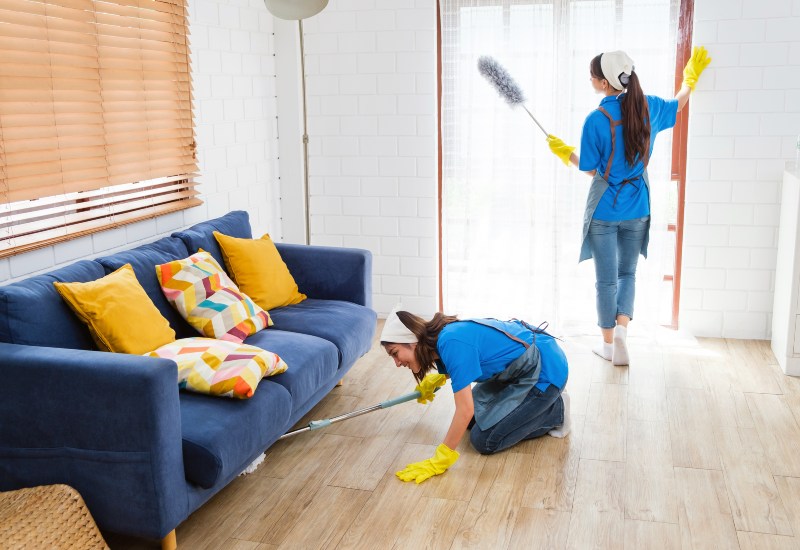 Two cleaners cleaning a home in Phoenix, AZ, show the benefits of hiring an expert cleaning service